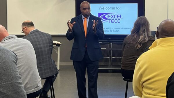Dr. Barnes speaking at Excel Tecc